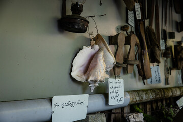 Antique seashell and wooden tools in open-air museum