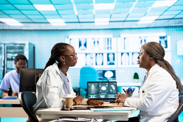 Female physician measures the oxygen saturation and heart rate with oximeter at routine checkup,...