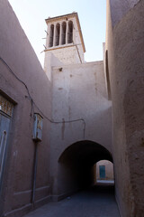 Traditional vaulted alleyway in Yazd, Iran, showcasing mud-brick architecture and the timeless charm of ancient Persian urban design.