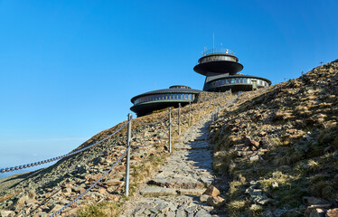 Hiking trail to a modern mountain hut on the Sniezka mountain peak in the Karkonosze Mountains