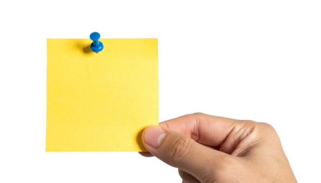 A hand holding a yellow sticky note with a blue pin