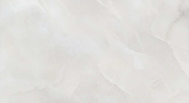 Abstract close-up of white onyx stone with subtle veining and smooth, flowing patterns creating a soft, elegant texture.