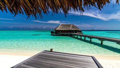 Paradise beckons with a tropical overwater bungalow and inviting turquoise waters on a sunny, idyllic beach resort.