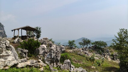 house on the rocks mountain background