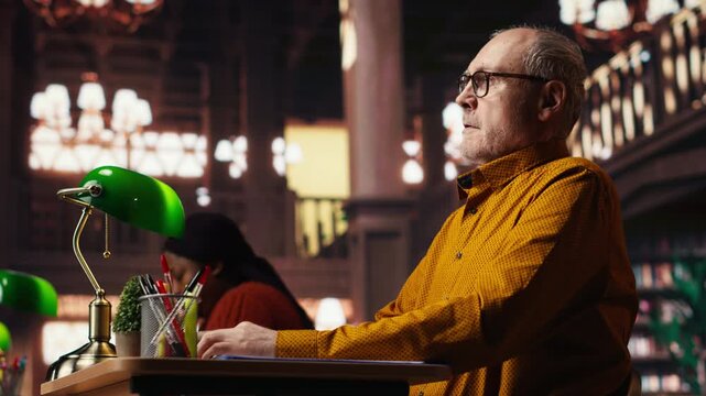 Elderly man with a respiratory problem having a panic attack in the library, struggling to learn due to a discomfort or breathing issue. Senior person in distress, hyperventilation. Camera B.