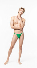 Fototapeta premium confident man in a vibrant green hong, ideal for lingerie, swimwear, and fashion content. Perfect for e-commerce and lifestyle brands.