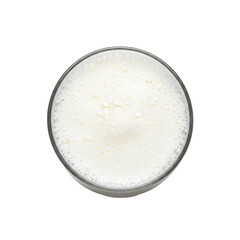 Overhead view of a glass of fresh, frothy milk, showcasing its creamy texture and white foam. Ideal for dairy concepts, coffee, or healthy lifestyle visuals.