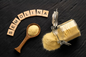 Wheat semolina in a spoon and glass jar - Triticum