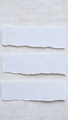 Torn paper strips on white wood background for message board or scrapbook layout use