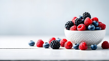 Fresh mixed berries in bowl raspberries blueberries blackberries healthy eating diet