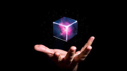 Holographic cube floating above hand with nebula inside on black background art