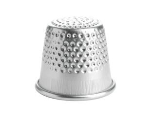A silver thimble, a classic sewing accessory, isolated on a clean white background.