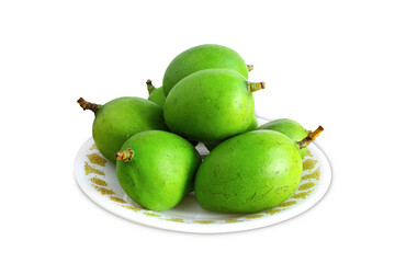 fresh young green mango in plate, best for Indian mango pickle, mango chundo, amchur powder, also...