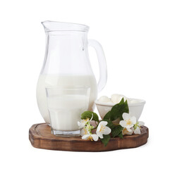 Different fresh dairy products and flowers isolated on white