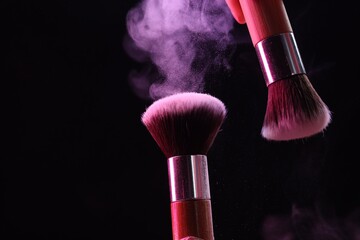 Makeup brushes with color eye shadow on black background, closeup