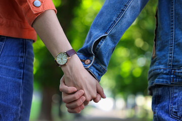 Lovely couple walking together in park, closeup