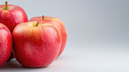 Delicious ripe apples showcasing health benefits on a clean background