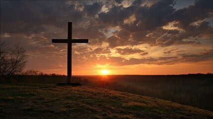 Serene Sunset Behind a Cross Silhouette Overlooking a Peaceful Landscape with Dramatic Cloud Patterns and Warm Golden Light