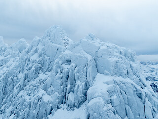 The Majestic Ice Peaks Stand Tall Under a Dramatic and Beautiful Sky Above Them Today