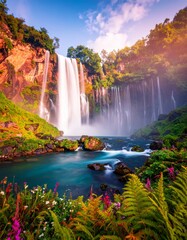 Fototapeta premium A tranquil waterfall nestled in a dense jungle, with sunlight streaming through the canopy, illuminating the falling water and creating a peaceful, magical atmosphere.