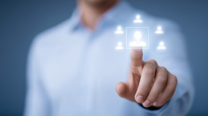 Close-up of hand touching virtual screen with glowing user icon symbolizing digital recruitment and HR management.
