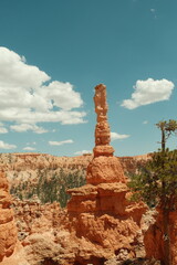 Giant rock spire formations, natural red rock hoodoos, blue skies in Bryce Canyon National Park...