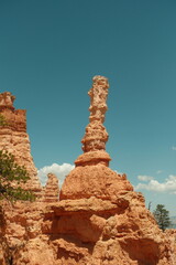 Giant rock spire formations, natural red rock hoodoos, blue skies in Bryce Canyon National Park...