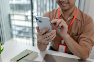 he is on the phone with his partner when he works in the office, an employee is working in marketing department, businessman is talking with his customer on the phone, finance manager in the office
