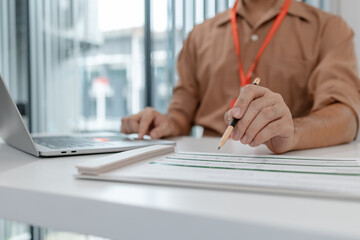 Fototapeta premium businessman is working in his private office, marketing manager works with a lot of paperwork, an employee is working for company, finance manager is in the office