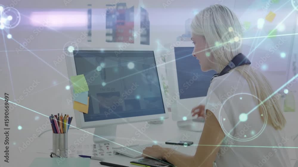 Poster woman typing on keyboard at dual monitors, unveiling animated data nodes illustrating connectivity