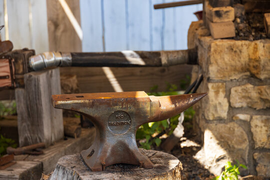 Rusty old anvil in a workshop