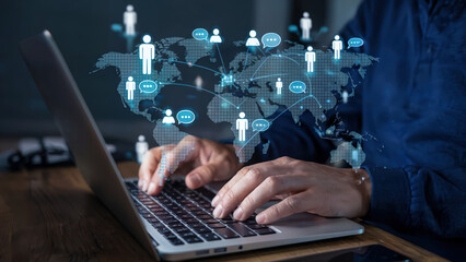 Person communicates globally through internet connection on a laptop