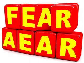 Colorful blocks spell the word fear in a playful arrangement on a bright background in an indoor setting