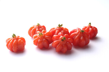 Portion of tropical pitanga fruit on a white background