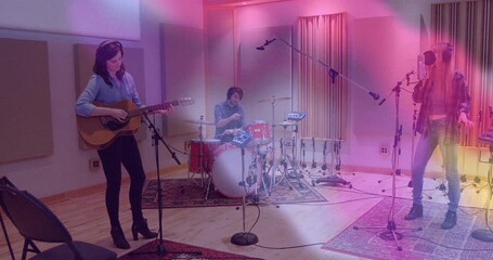 Drummer giving 2 count starting beat as guitarist strumming, vocalist singing into mic in studio - Powered by Adobe