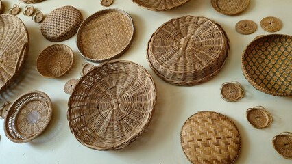 Kracheh, Cambodia - 29 June 2025. Assorted traditional rattan baskets are neatly displayed, highlighting different weaving styles and circular forms.