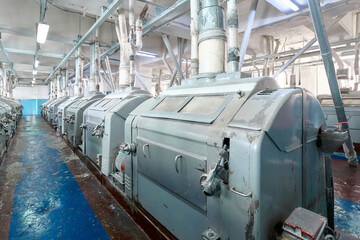 Roller mill flour milling machine in operation at a grain processing facility