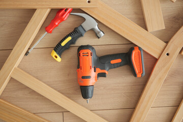 Tools arranged on wooden surface for home projects