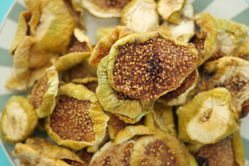 Dried fruit slices arranged on colorful plate