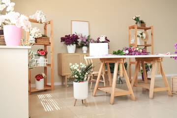 Cozy flower shop with many lilacs bouquets