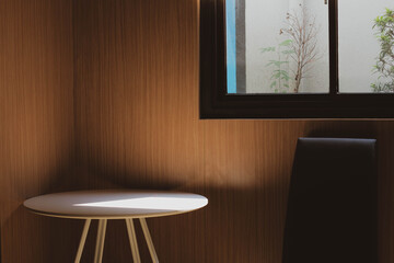 Empty interior with classic style and modern furniture, illuminated by sunlight through window