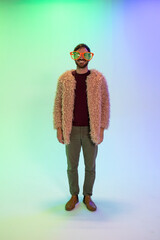 man poses in funny glasses