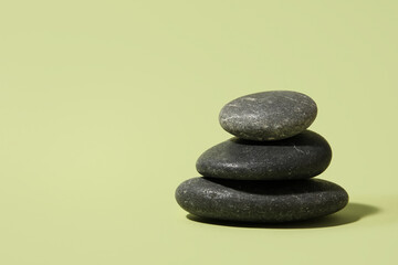 Beautiful sea stones on green background