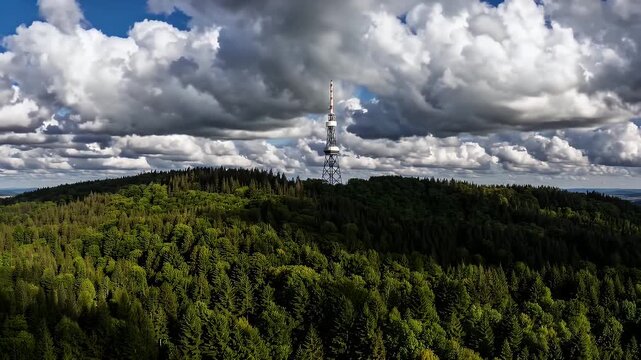 beautiful shifting cloud shadows move across rolling hills and dense pine forest beneath Radhost peak in Czech Republic timelapse highlighting the harmony between natural light and highland