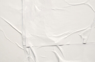 white crumpled and creased glued wrinkled paper poster texture background
