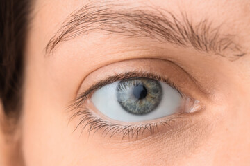 Young woman with gray-blue eyes, closeup