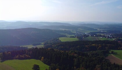 Obraz premium Serene Aerial View of Rolling Hills and Forests