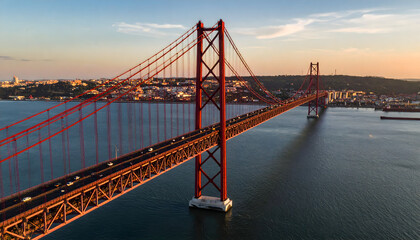 Fototapeta premium Red Suspension Bridge Over River at Sunset, Lisbon