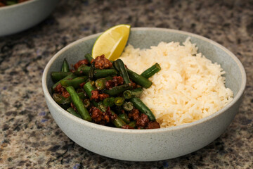 Close-Up of Homemade Sweet Chili Beef Stir Fry with Green Beans and Rice