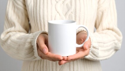 Woman holding a blank white mug